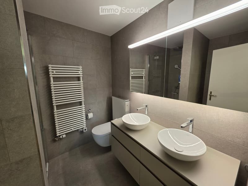 {"visible_features": [], "type": "Bathroom", "objects": ["sink", "sink", "toilet", "towel rack", "mirror", "cabinet", "cabinet", "cabinet", "cabinet", "cabinet", "cabinet", "cabinet", "cabinet", "cabinet", "cabinet", "cabinet", "cabinet", "cabinet", "cabi