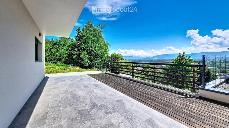 Balcony with wooden decking, tiled floor, metal railing, and scenic mountain view.