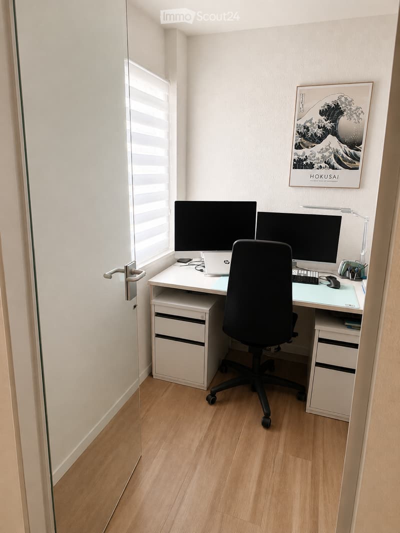 A modern, minimalist home office with a white desk, ergonomic chair, dual monitors, laptop, keyboard, mouse, and a decorative picture frame on the wall.