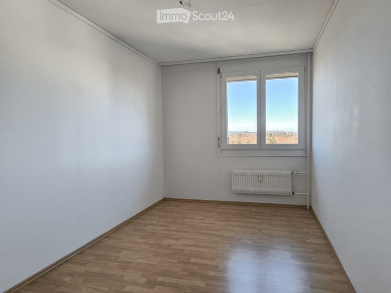 empty room, white walls, wooden floor, window with view