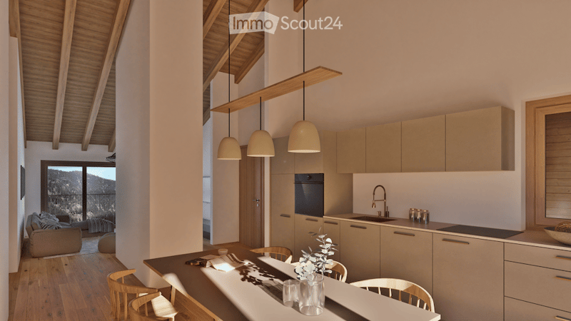 Modern open-plan living and dining area with a kitchen, featuring light wood cabinets, pendant lights, a sofa, and a dining table with chairs. The space has large windows offering a scenic mountain view.