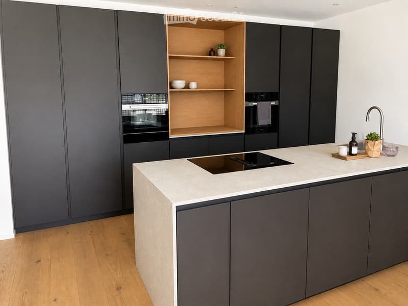 Modern kitchen with dark grey cabinets, light wooden shelves, and a white marble countertop. Features an integrated oven, a sink with a modern faucet, and various small decorative items on the counter.