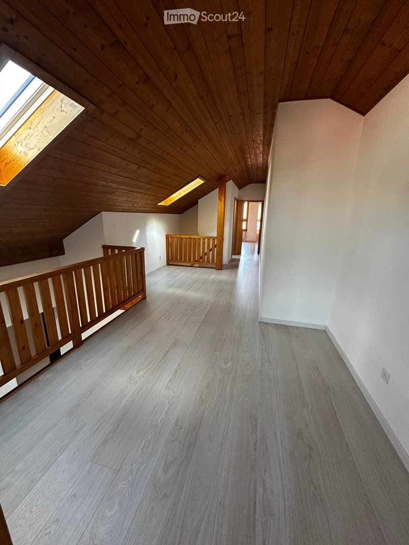 empty room, wooden floor, wooden railing, skylight window