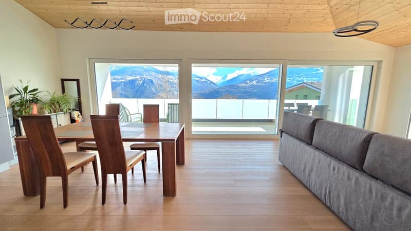 dining room with wooden table and chairs, large windows, wooden floor, couch, plants, wooden ceiling