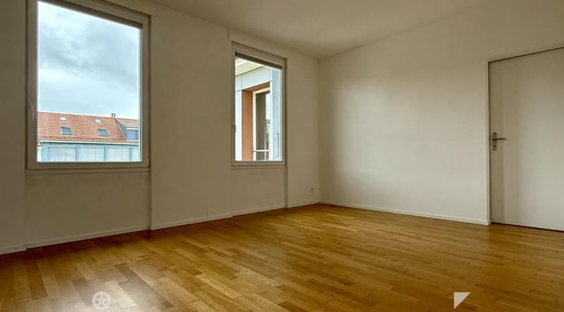 Completely empty room with bare walls and wooden floor. No furniture or equipment.