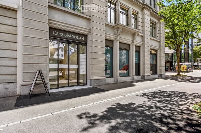Facade of a multi-story building with large windows and a glass entrance door labeled 'Kanzleistrasse 4'.