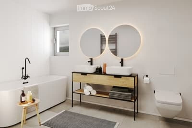 Modern bathroom with a bathtub, double sink vanity, large mirrors, and a small wooden stool holding toiletries.