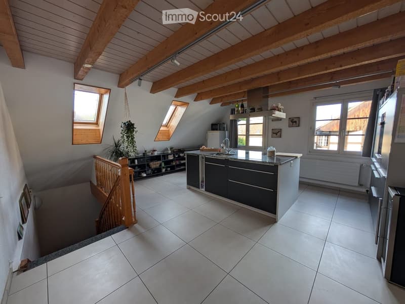 modern kitchen, large tiled floor, wooden beams, modern cabinets, large windows, attic
