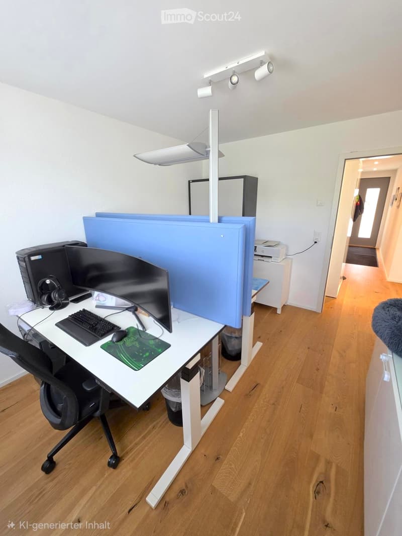 A modern, well-lit workspace with a white desk, ergonomic chair, dual monitors, keyboard, mouse, mouse pad, headphones, and a large screen divider. The room features wooden flooring and white walls.