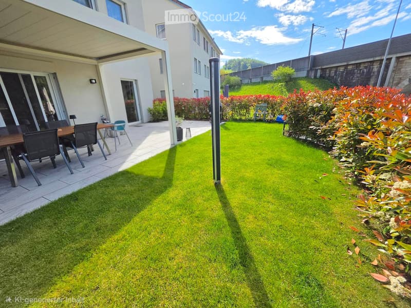 Well-maintained garden with green lawn, trimmed bushes, and a patio area with a table and chairs.