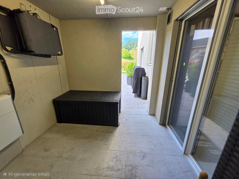Balcony with tiled floor, large sliding glass door, bench, and covered outdoor furniture visible through the doorway.