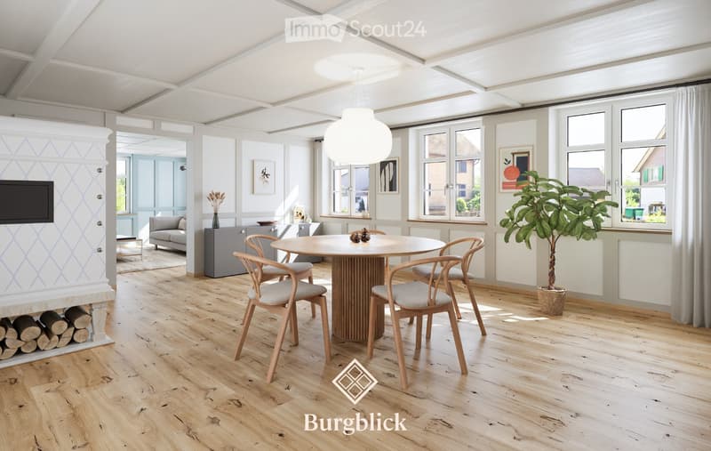 Bright, open living and dining area with wooden flooring, large windows, a round dining table with four chairs, a sofa, a television, and a potted plant.