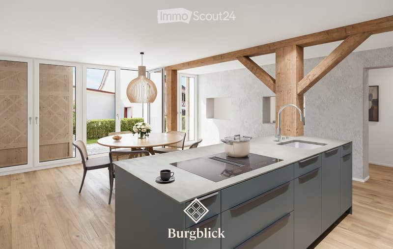 Modern kitchen with a central island, induction cooktop, sink, and pendant light. Dining area with a round table and chairs, flower vase, and a view of the garden through large windows.