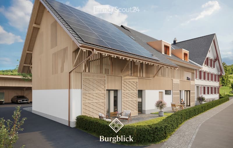 A modern two-story house with a combination of wooden and white facades, featuring a solar panel roof, a covered garage, and a well-maintained garden with outdoor seating.