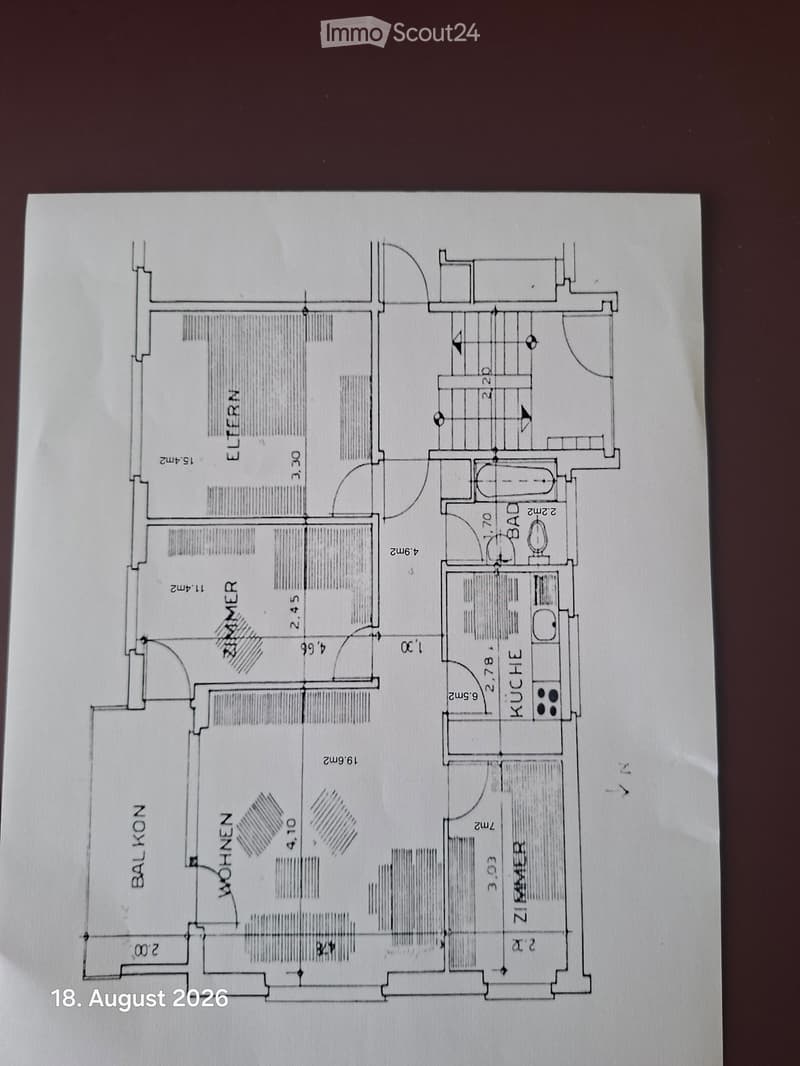Floor plan showing a layout with labeled rooms including Wohnzimmer (living room), Schlafzimmer (bedroom), Badezimmer (bathroom), and Küche (kitchen).