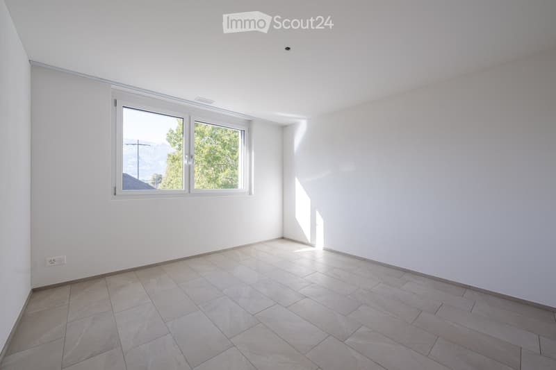 empty room, white walls, tiled floor, window with view of trees