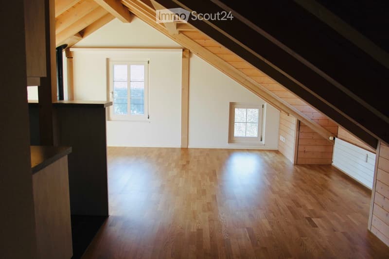 wooden floors, white walls, wooden exposed beam ceiling, two windows