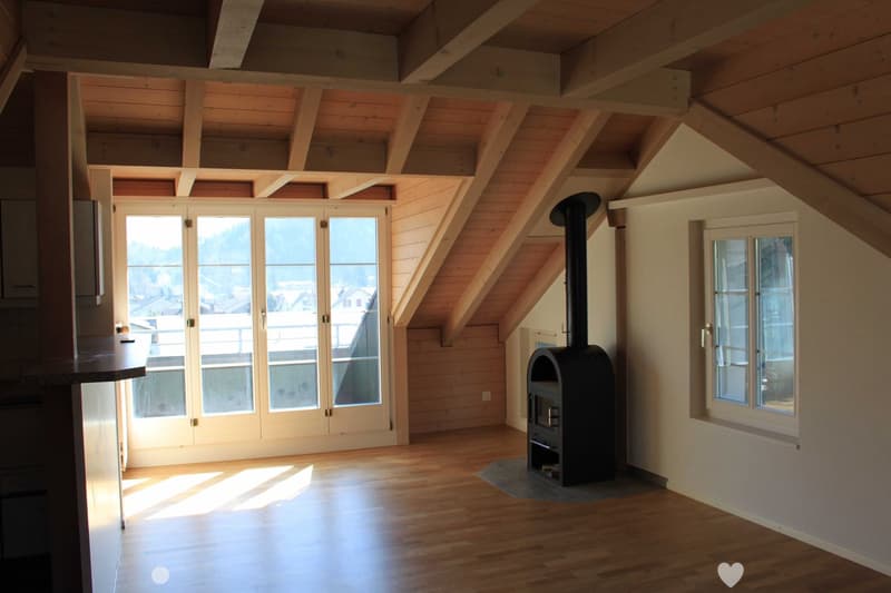 Fireplace, wooden ceiling, double doors to balcony, large windows