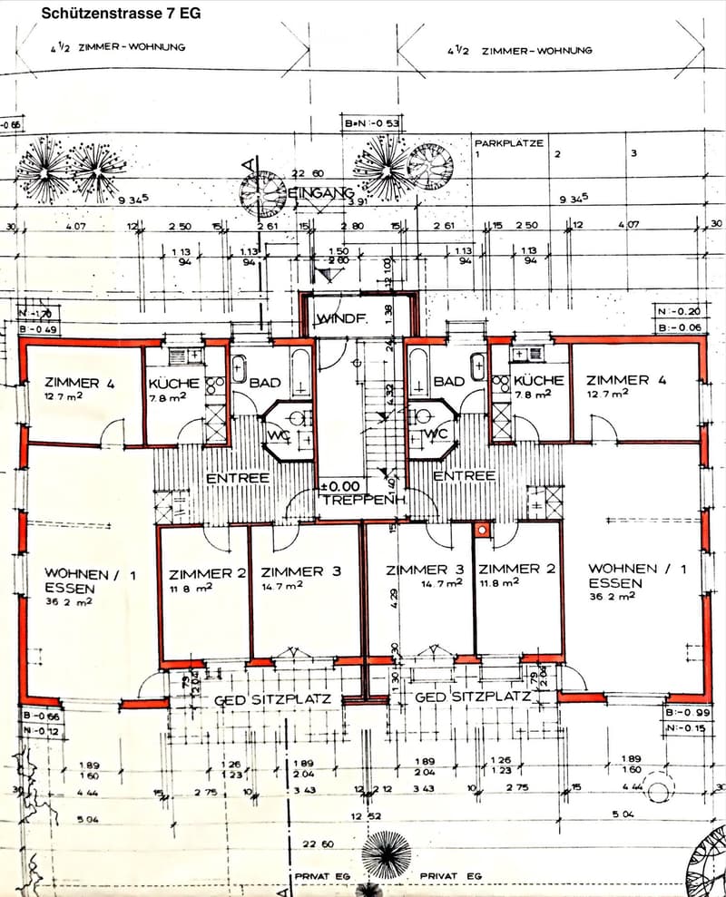 Floor plan of a residential unit showing two apartments with separate entrances, each featuring a kitchen, bathroom, and multiple bedrooms.