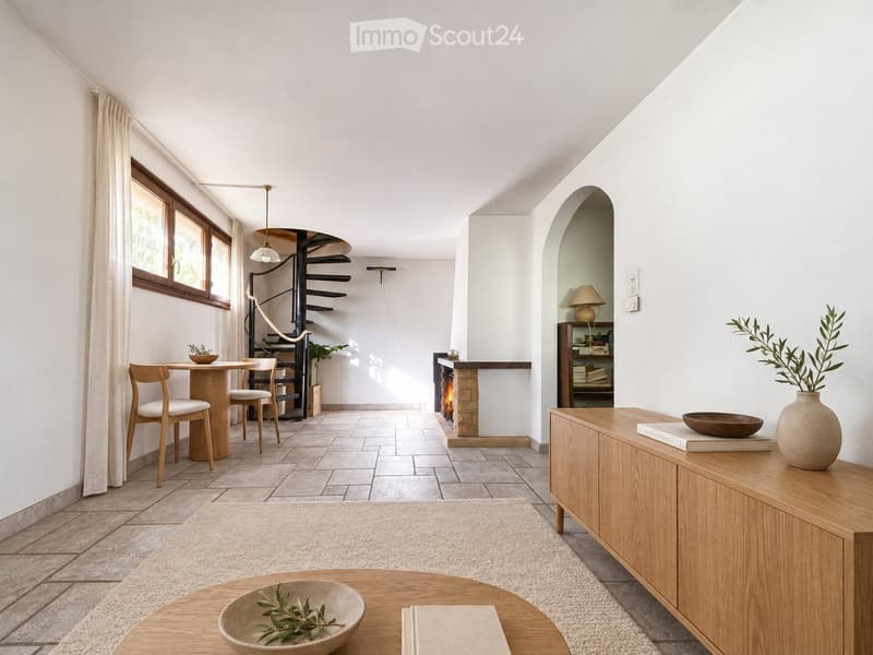 Bright, open living space with a fireplace, wooden furniture, and modern decor.