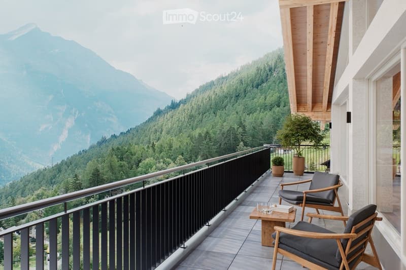 Balcony with wooden chairs, small table, potted plants, and a scenic mountain view.