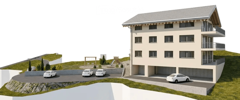 3-story residential building with garage, balconies, and parking area with several cars.