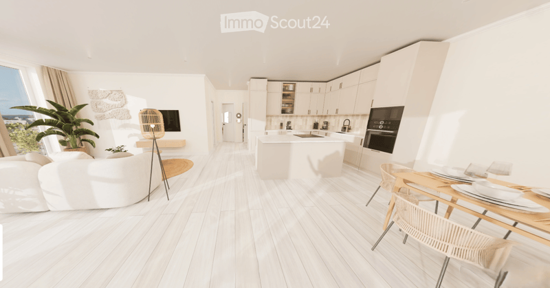 Modern, open-plan living and dining area with white walls, light wood flooring, and large windows offering a scenic view. Features a white sectional sofa, coffee table, floor lamp, TV, kitchen island with appliances, and a dining table with chairs.