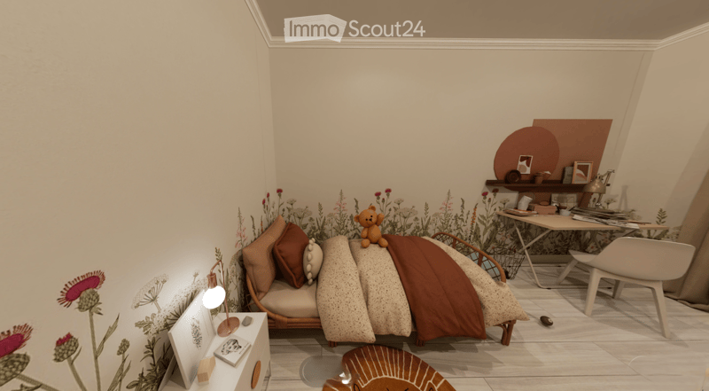 Cozy bedroom with a small sofa, decorative pillows, a blanket, a table lamp, a nightstand, a desk, and a shelf with various items.