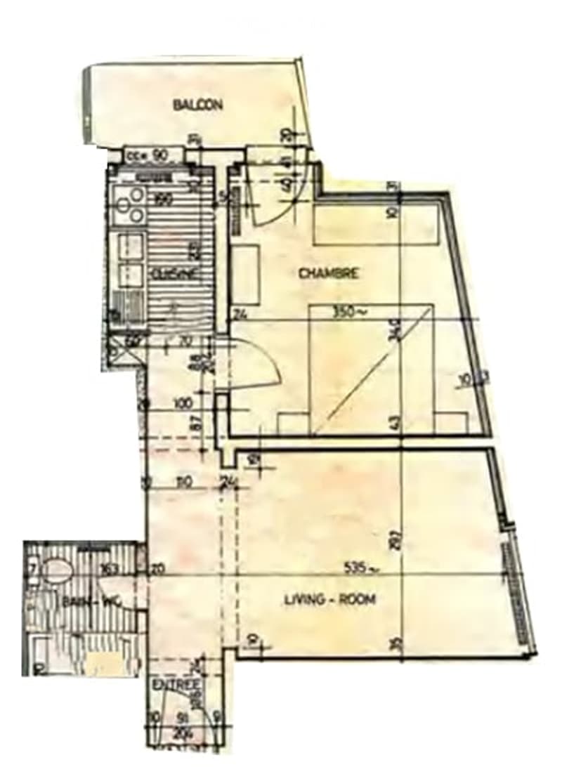 Floor plan showing a living room, bedroom, balcony, and bathroom with labeled dimensions.