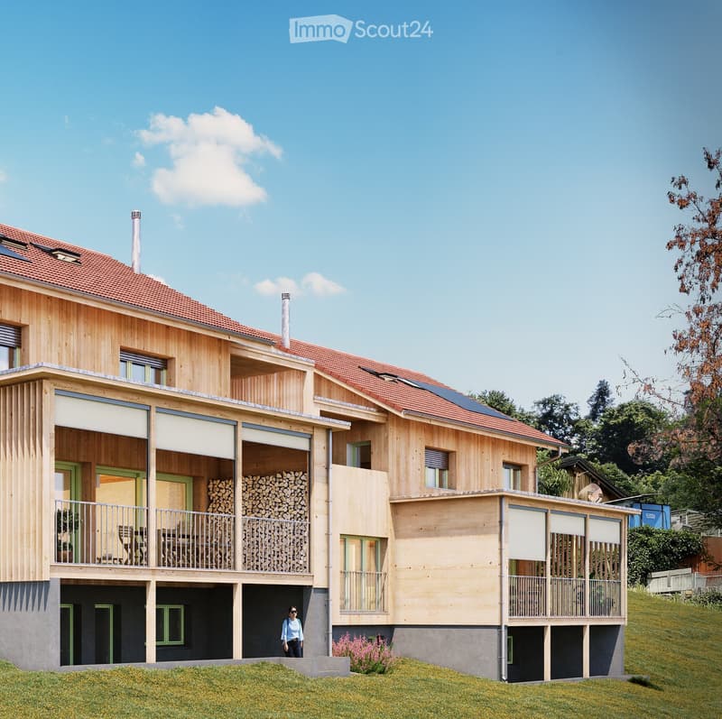 multi-storey wooden house, red roofs, solar panels, balconies, ground-level entrance