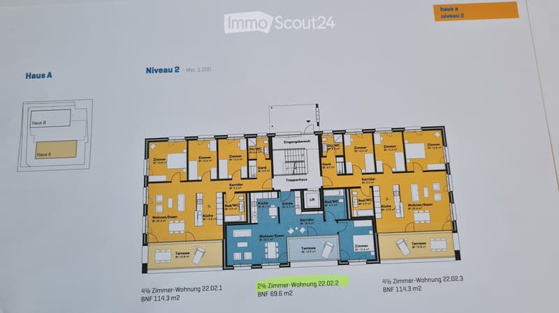 Floor plan showing three apartments (2.5-room, 3-room, and 4.5-room) with labeled rooms including living spaces, bedrooms, bathrooms, kitchen, and terraces.