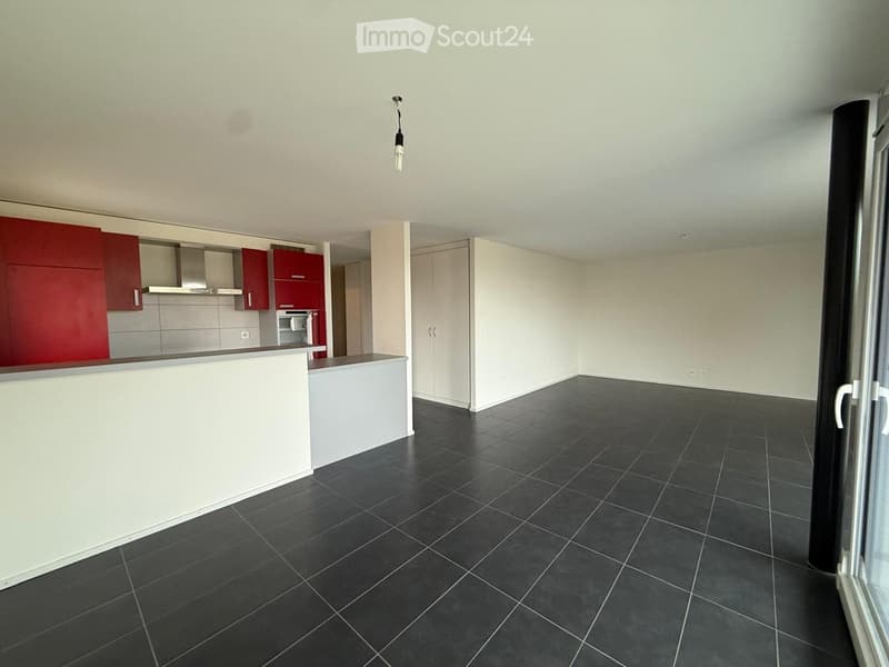 open kitchen, red cabinets, stainless steel hood, kitchen appliances, tile flooring, white ceiling