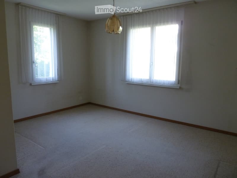 empty room, white walls, white floor, two windows, white curtains, pendant light