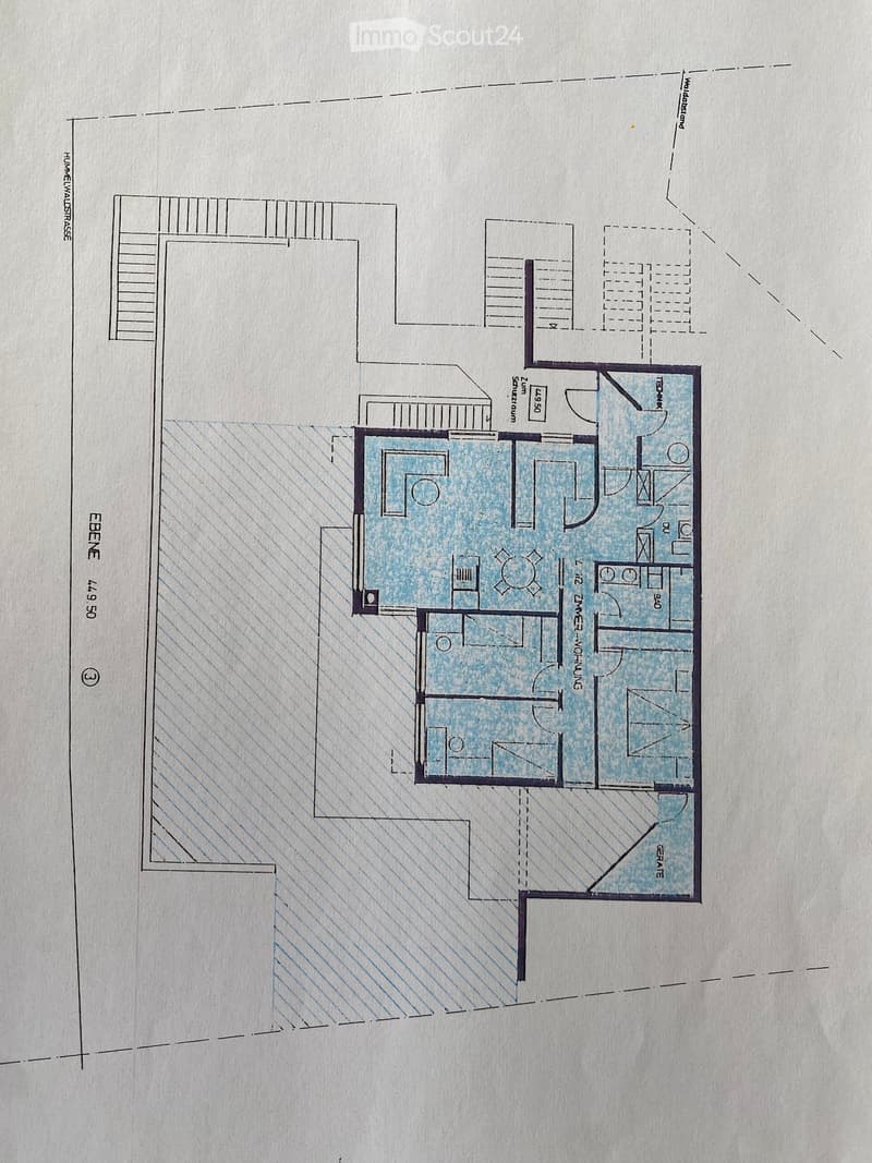 Floor plan of a residential unit with multiple rooms including a living area, bedrooms, bathrooms, and a kitchen.