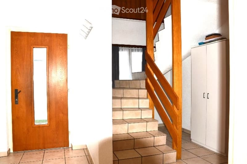 A hallway with a wooden door on the left and a staircase leading upwards on the right, featuring tiled flooring and white walls.