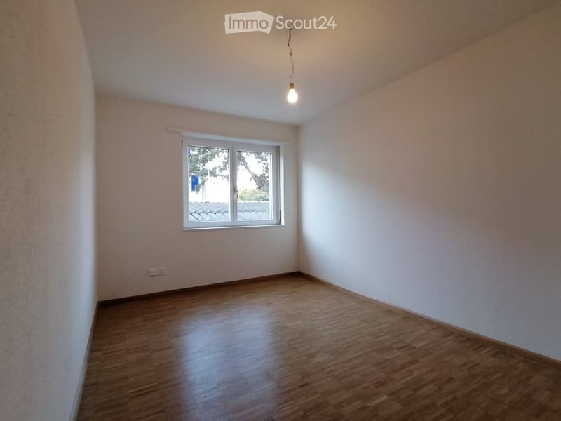 Wooden floor, empty room, single light fixture, window