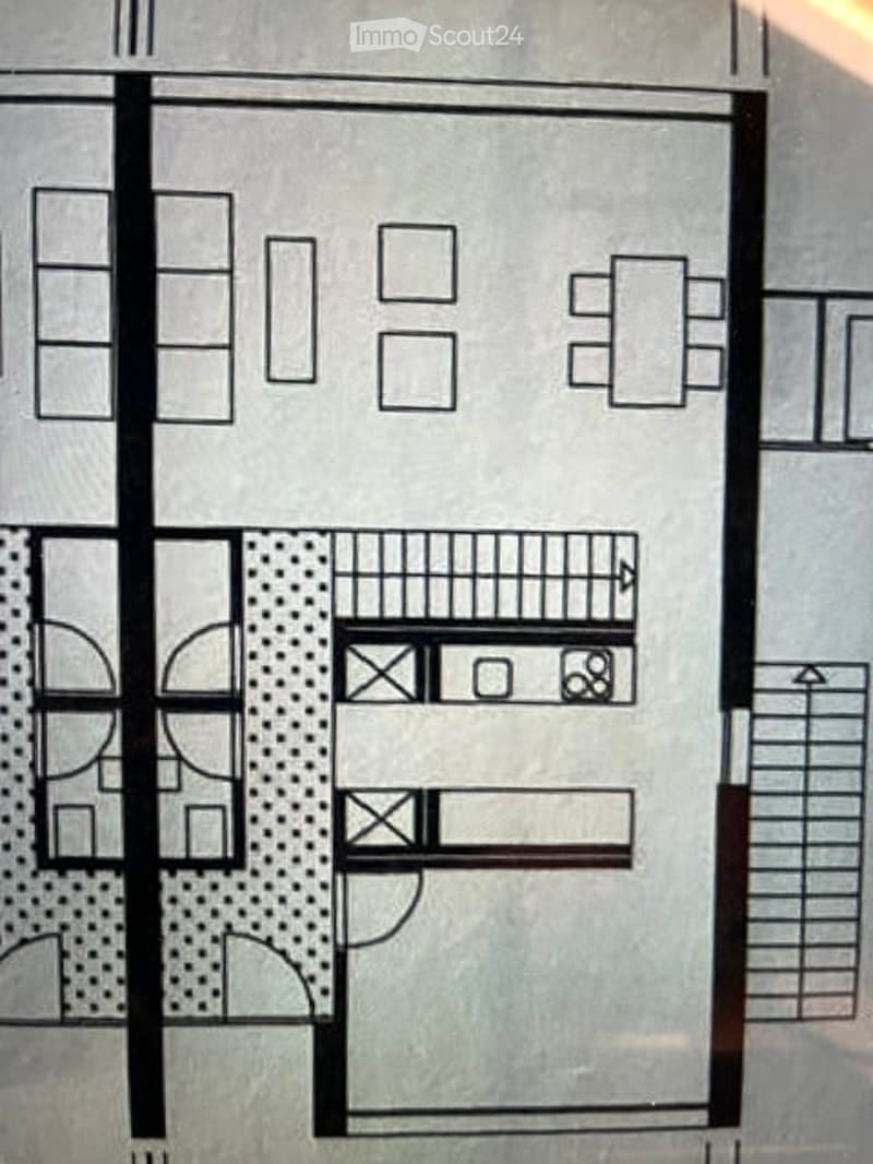 Floor plan of a multi-level building with living room, kitchen, bedrooms, bathrooms, and a balcony.