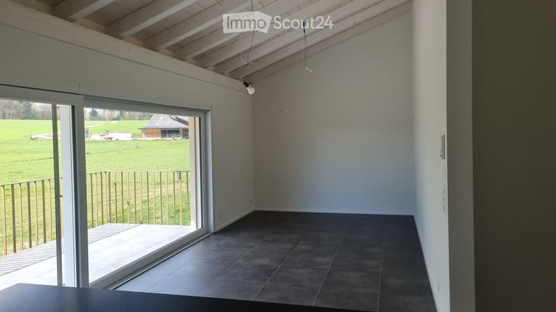 empty room, sliding glass doors, balcony, tiled floor, white walls, ceiling with beams