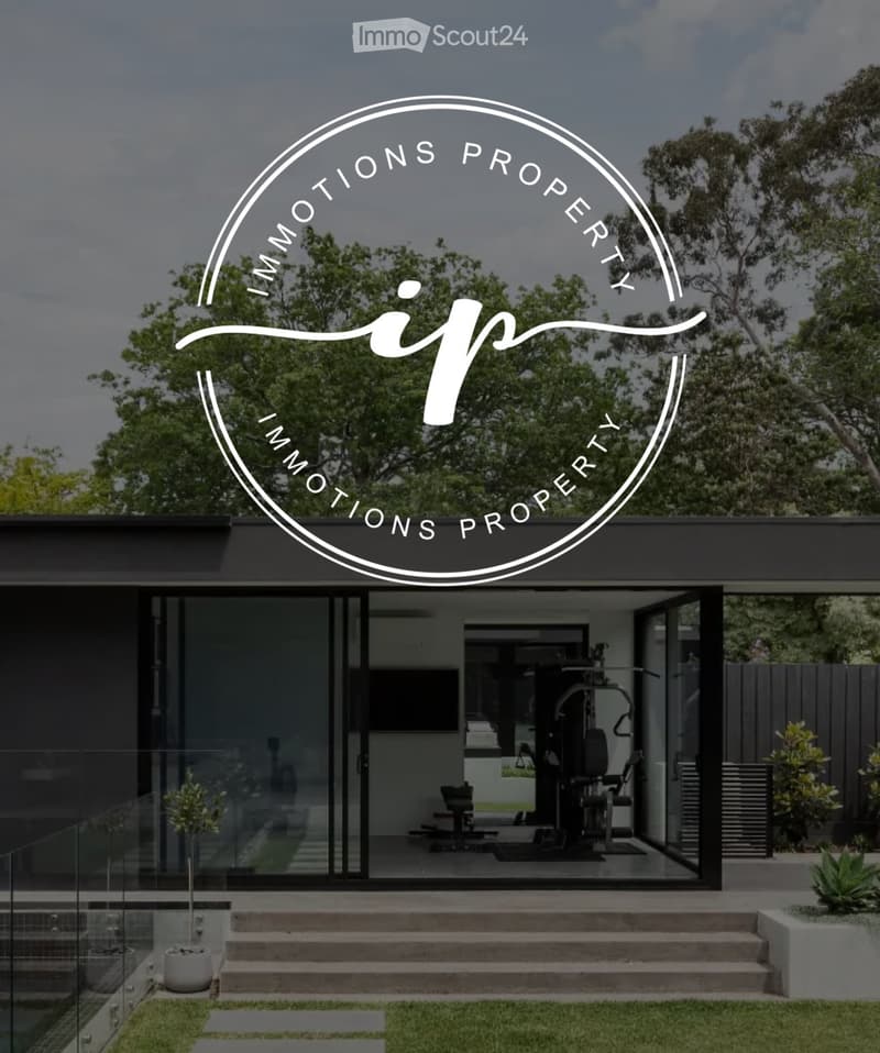Modern two-story house with large glass windows and a raised ground floor, featuring a fitness area inside and a landscaped garden with steps leading up to the entrance.