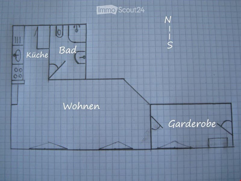 Floor plan showing a kitchen, bathroom, living area, and hallway.
