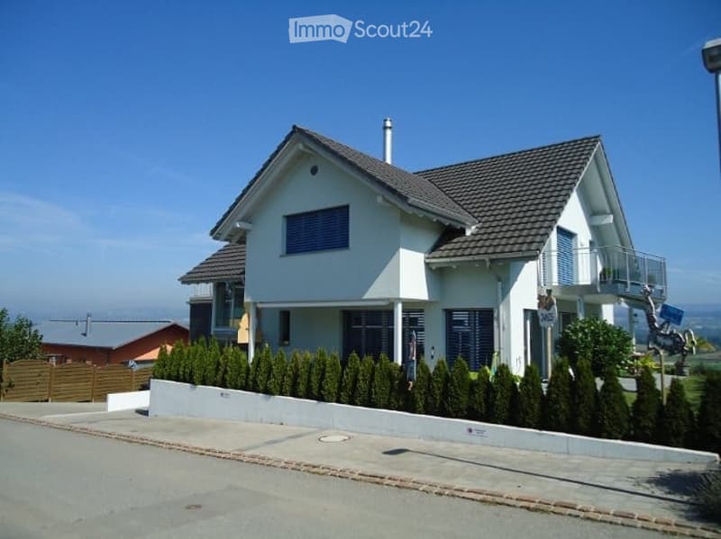 two story house, white paint, brown tiles, balcony, bush wall, chimney, fence