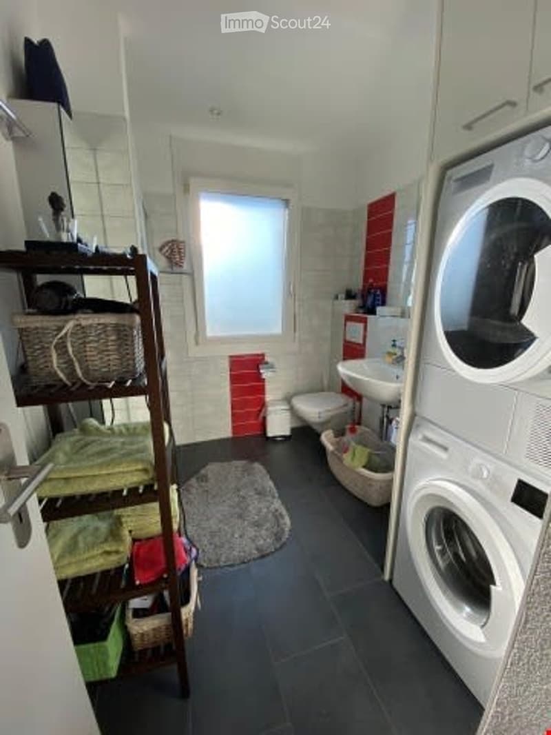 Bathroom with washing machine and dishwasher, white tiles, sink, toilet, small window