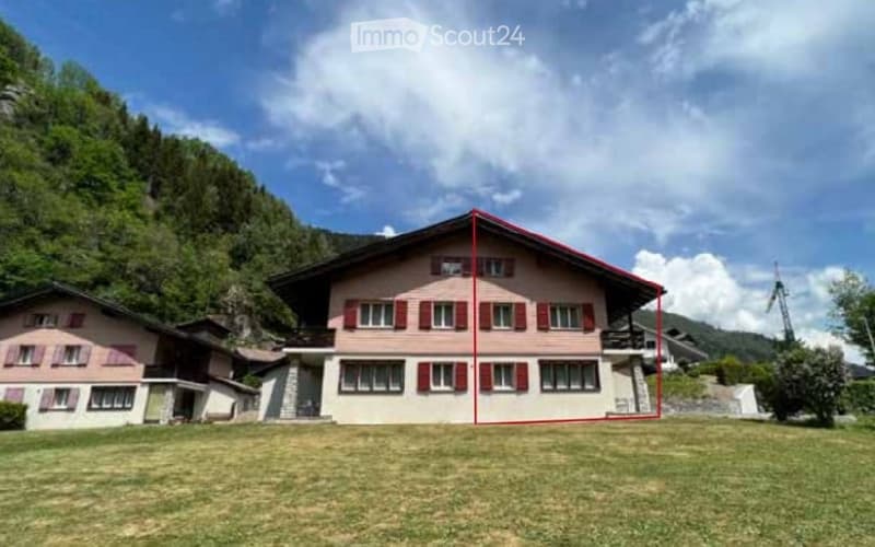 2-story house, red shutters, red roof, mountain in background