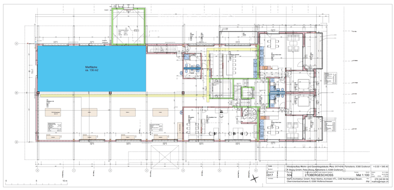 Floor plan of a commercial and residential building with multiple rooms, including offices, storage areas, and a large central courtyard.
