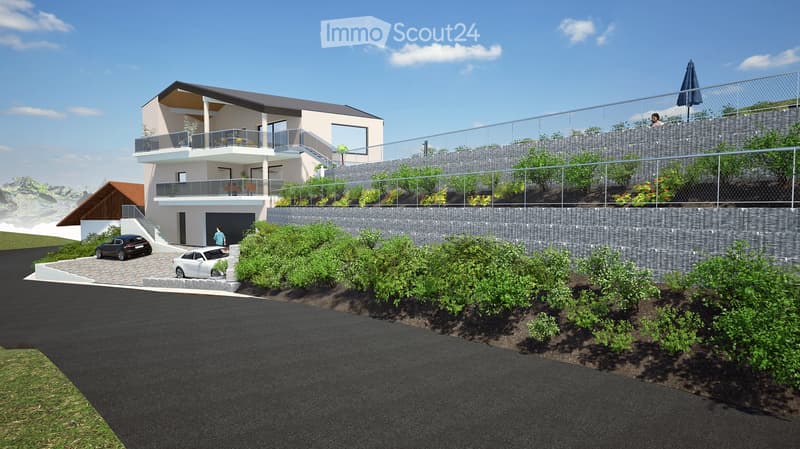 Modern two-story house with a raised ground floor, garage, balcony, and surrounding greenery.