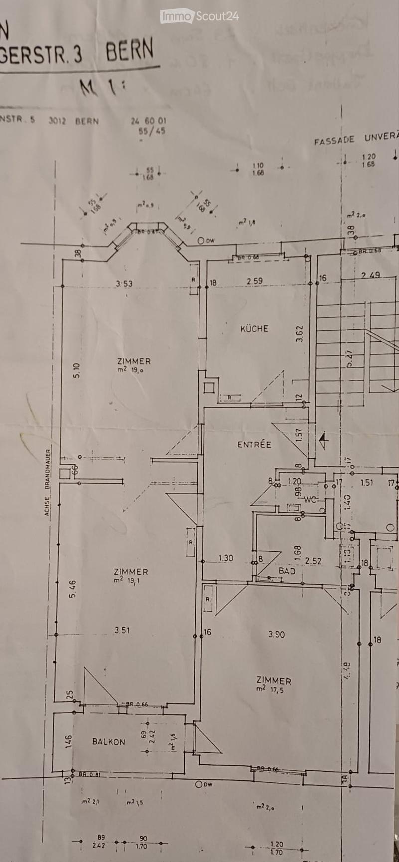 Floor plan of a residential unit showing a kitchen, entrance, bathroom, three bedrooms, and a balcony.