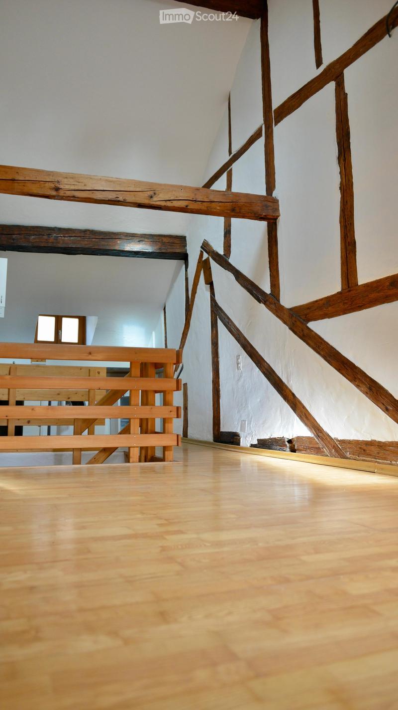 empty room, wooden floor, wooden beams, staircase
