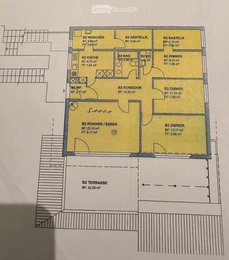 Floor plan of a second-floor apartment with labeled rooms including kitchen, bathroom, living/dining area, bedrooms, storage, and a terrace.