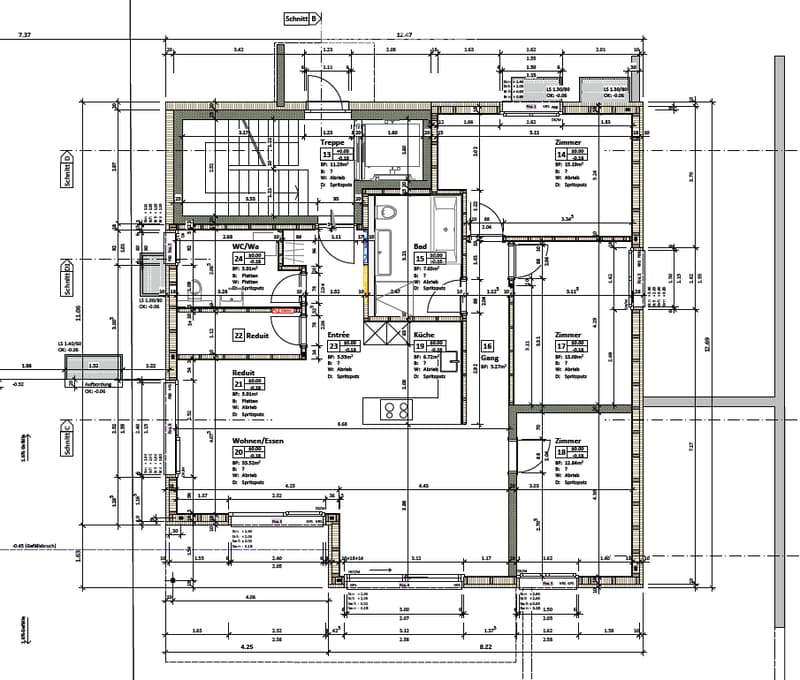 Floor plan of a residential building showing multiple rooms including a kitchen, living room, bedrooms, bathrooms, and entrance area.