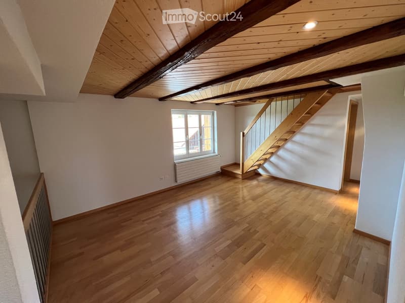 empty room, wooden floor, wooden ceiling, white walls, window, radiator, staircase
